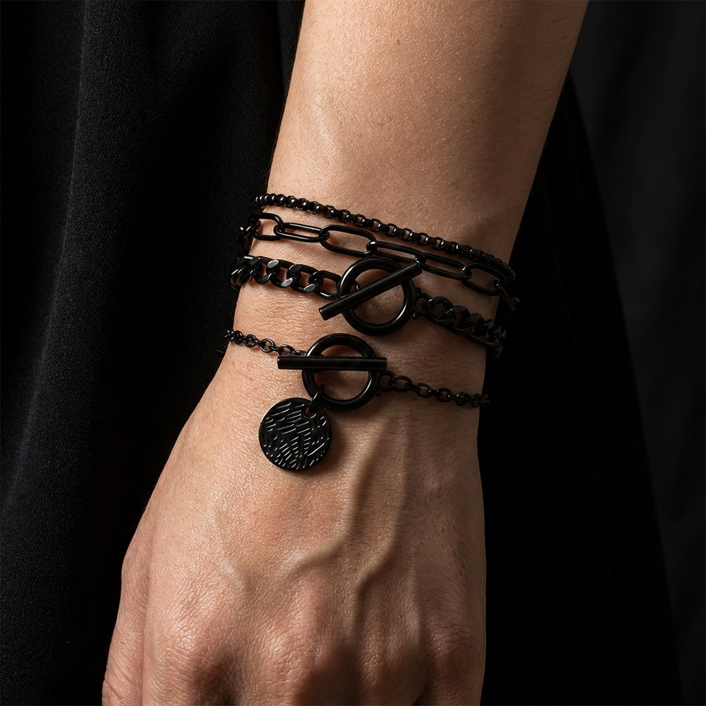 Blackout layered stainless steel bracelet on a black background