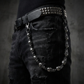 Skull stainless steel belt chain on a black background
