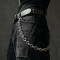 Deadweight stainless steel belt chain on a black background
